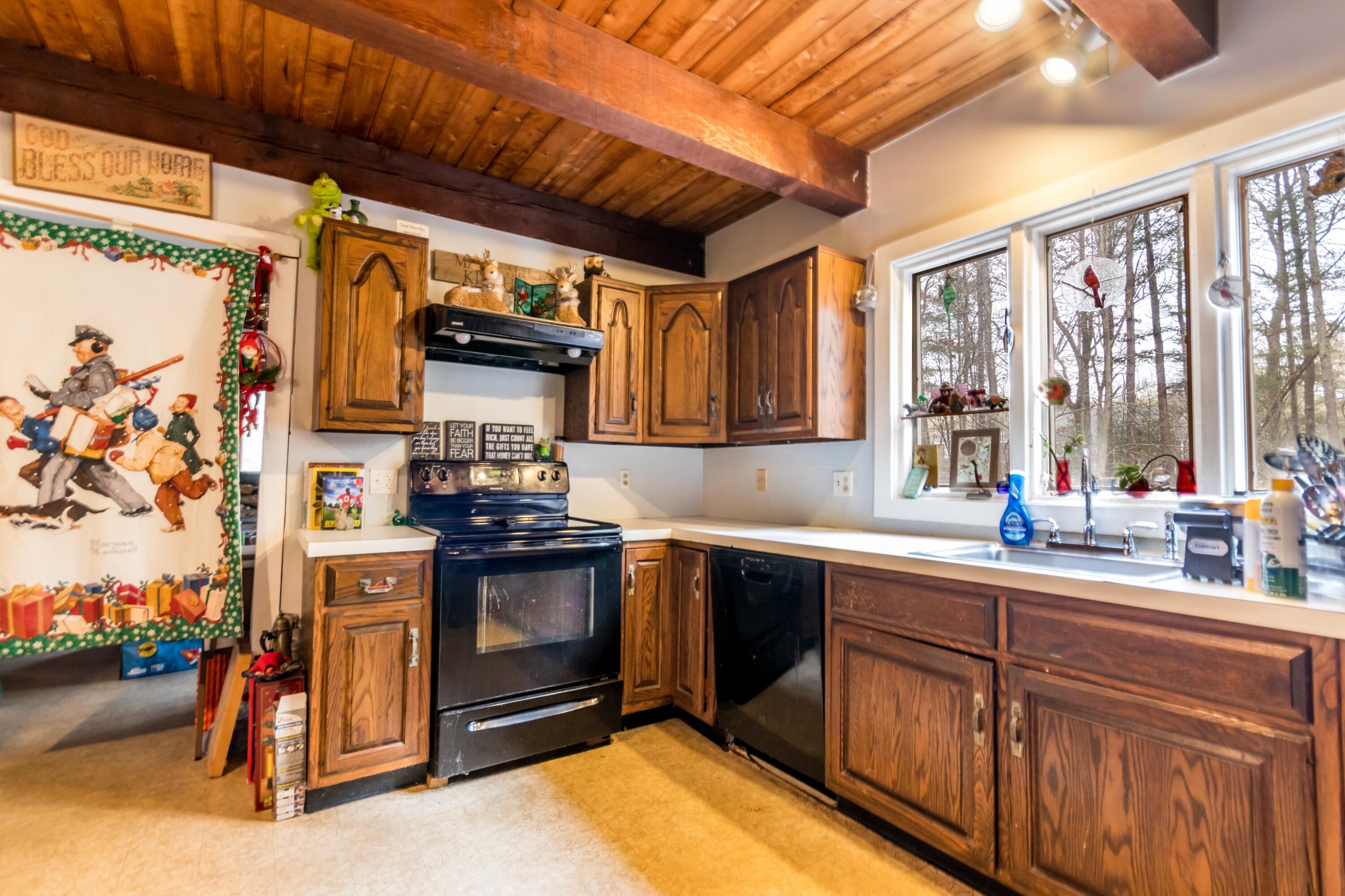 173 Titicut Road Raynham, MA 02767 - Photo 6 of 7 a kitchen with stainless steel appliances granite countertop a stove and a sink