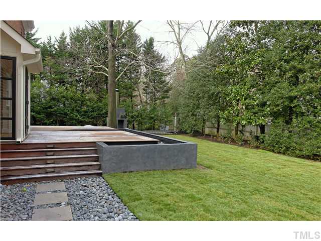 3312 Churchill Road Raleigh, NC 27607 - Photo 3 of 25 a view of a backyard with trees
