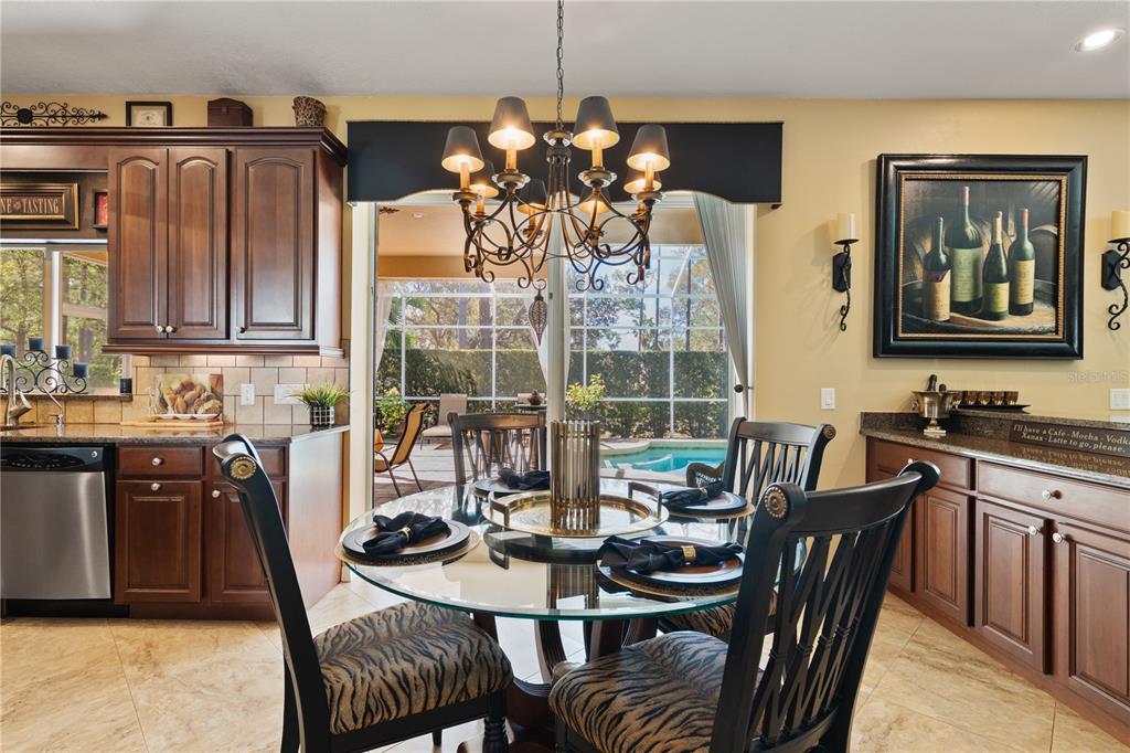 4202 Rotherham Court Palm Harbor, FL 34685 - Photo 15 of 61 a view of a dining room with furniture window and outside view