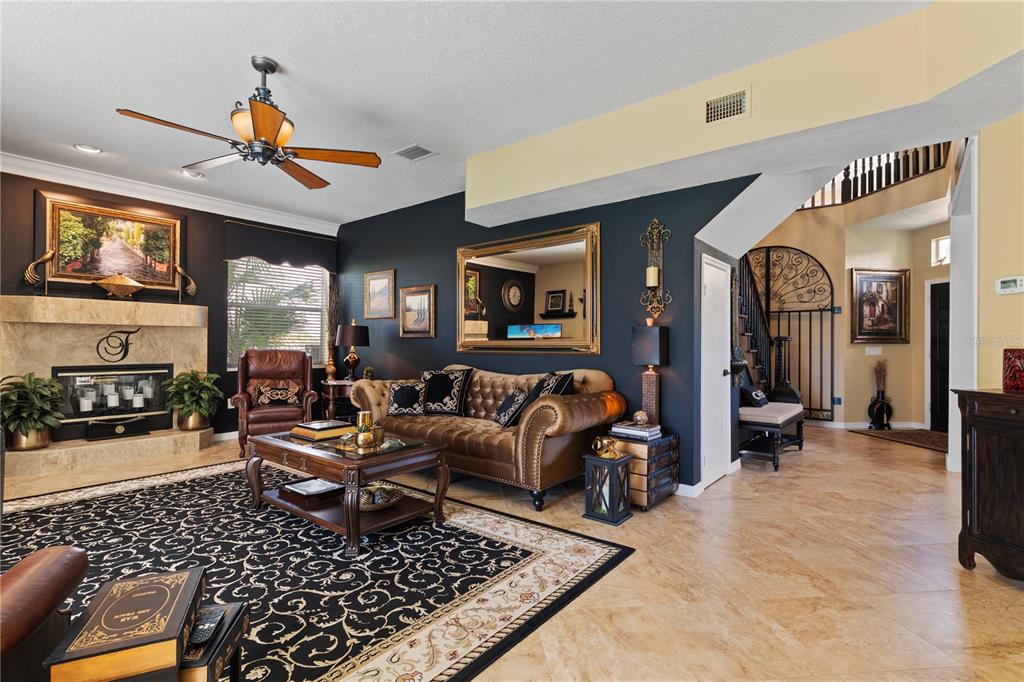 4202 Rotherham Court Palm Harbor, FL 34685 - Photo 20 of 61 a living room with furniture and a chandelier