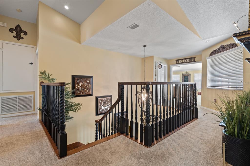 4202 Rotherham Court Palm Harbor, FL 34685 - Photo 27 of 61 a view of a hallway with a livingroom with furniture