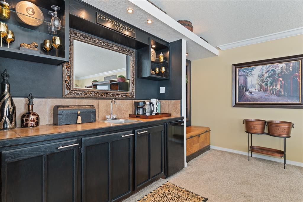 4202 Rotherham Court Palm Harbor, FL 34685 - Photo 31 of 61 a kitchen with stainless steel appliances granite countertop a sink and cabinets