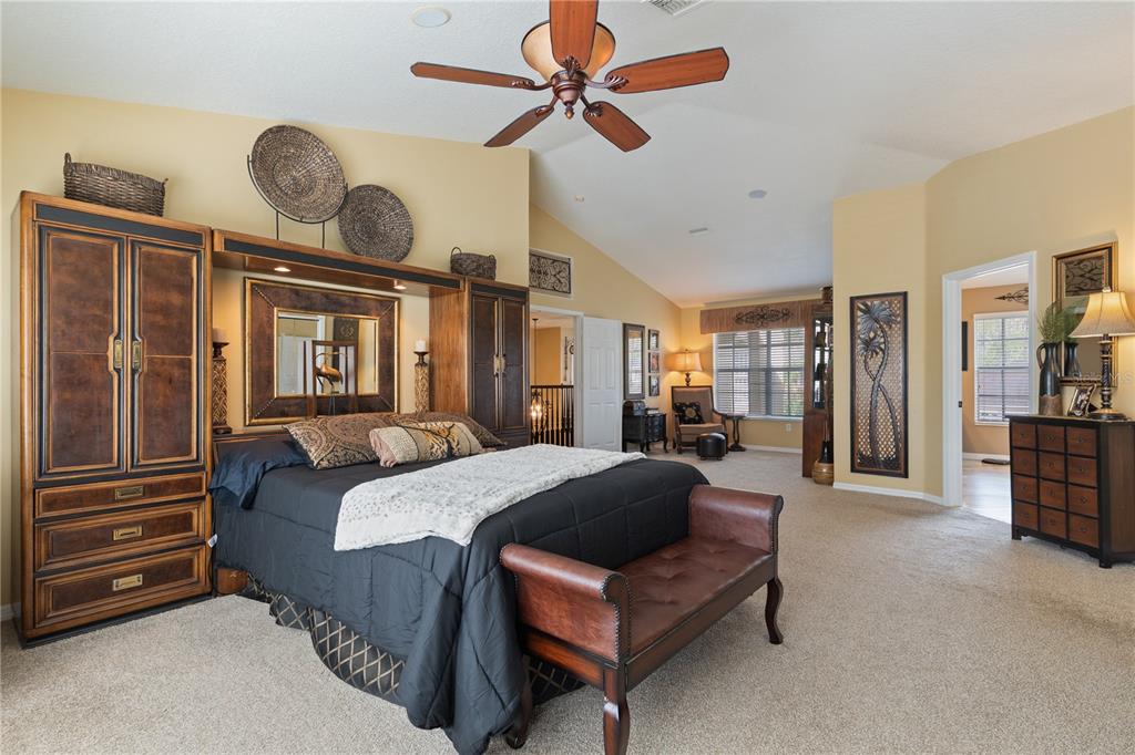 4202 Rotherham Court Palm Harbor, FL 34685 - Photo 34 of 61 a living room with furniture and a chandelier