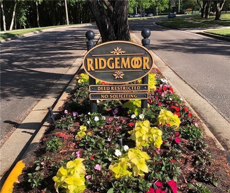 4202 Rotherham Court Palm Harbor, FL 34685 - Photo 61 of 61 a sign that is sitting in front of flowers