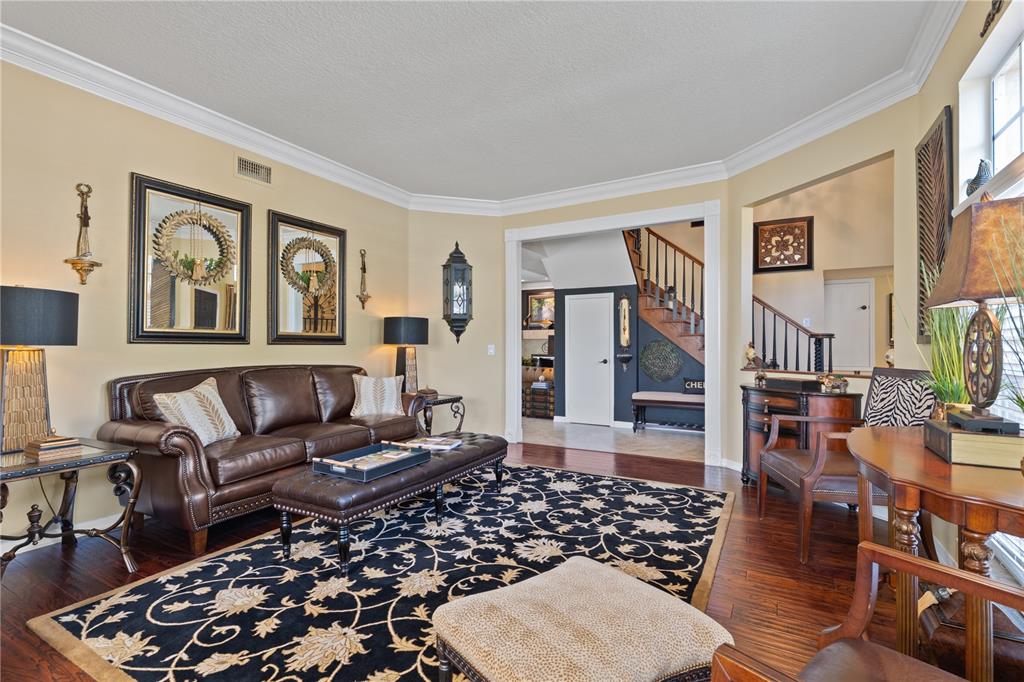 4202 Rotherham Court Palm Harbor, FL 34685 - Photo 9 of 61 a living room with furniture and wooden floor