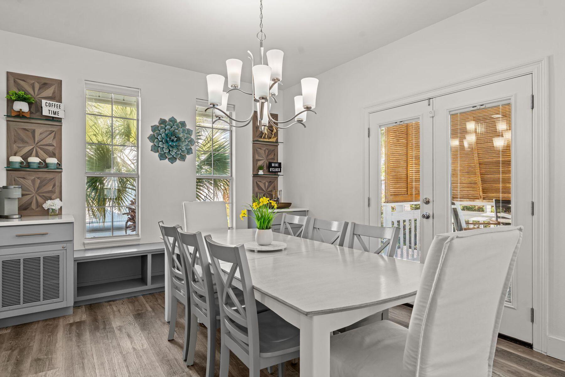 41 Longue Vue Drive Inlet Beach, FL 32461 - Photo 11 of 48 a view of a dining room with furniture a chandelier and wooden floor