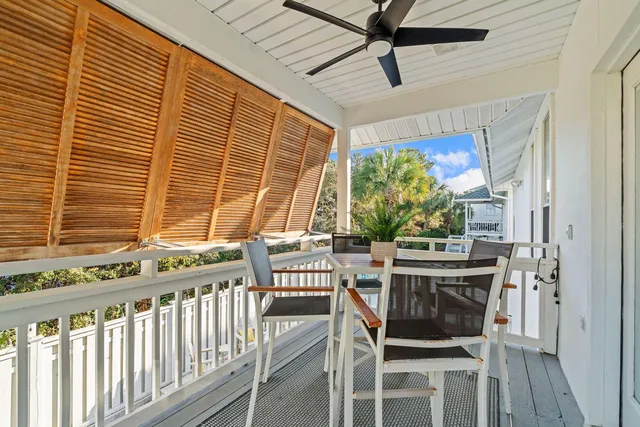 a view of a dining room with furniture and a window