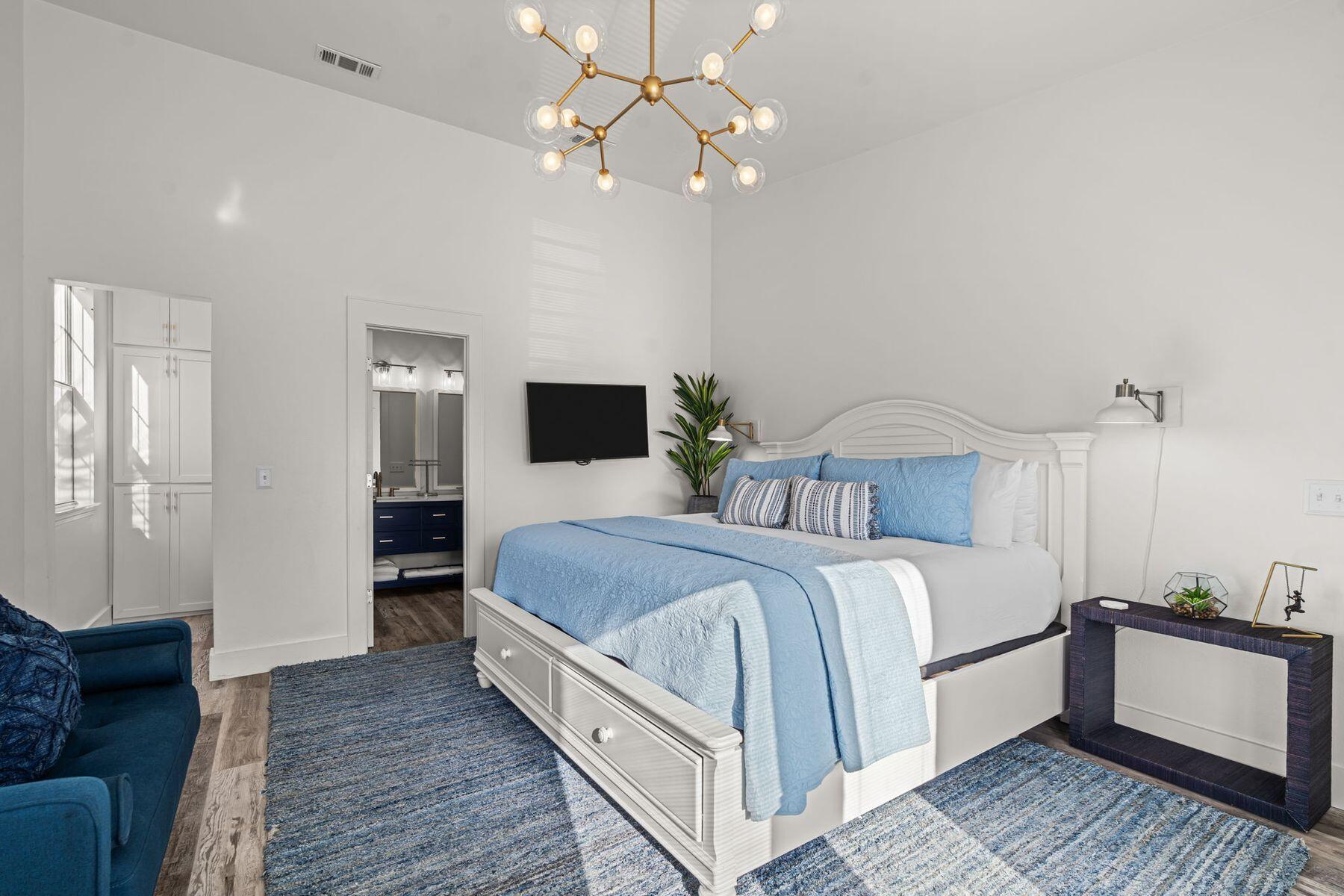 41 Longue Vue Drive Inlet Beach, FL 32461 - Photo 17 of 48 a bedroom with bed and a chandelier