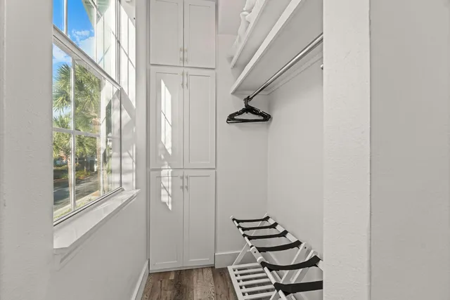 a view of an entryway with wooden floor