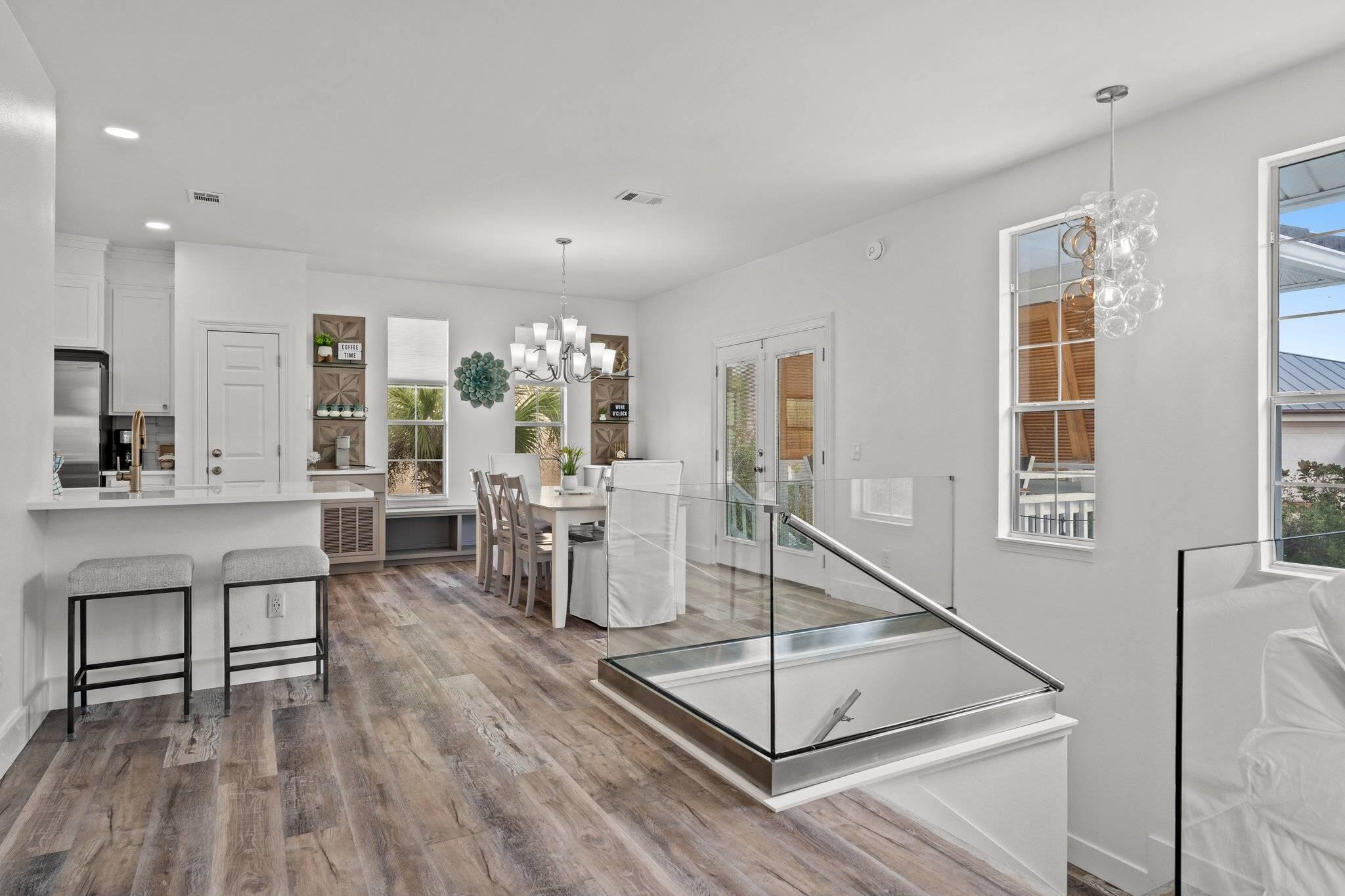 41 Longue Vue Drive Inlet Beach, FL 32461 - Photo 3 of 48 a living room with furniture a wooden floor and a large window