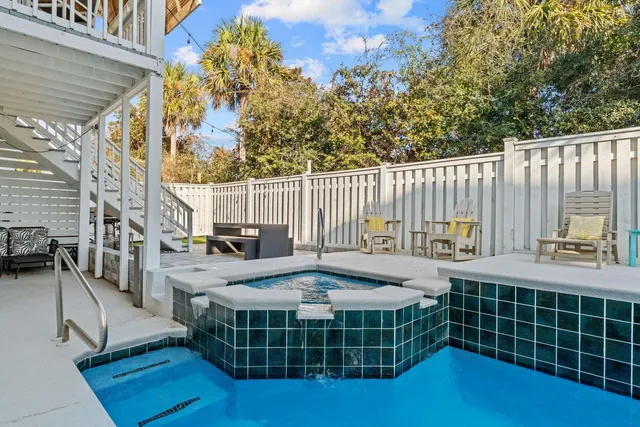 a view of a house with a wooden deck