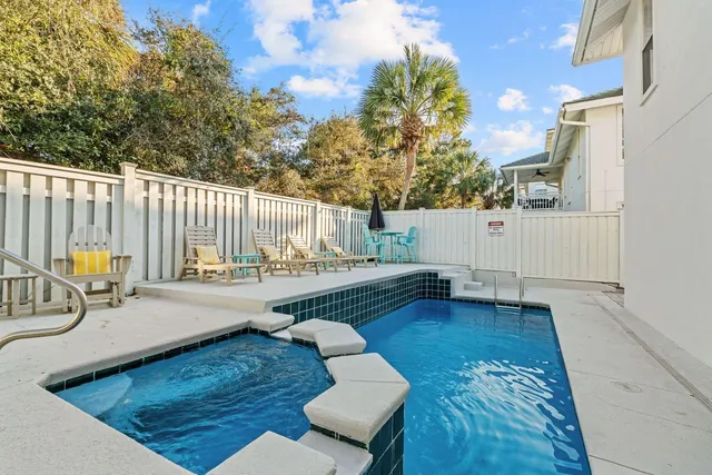 a view of a swimming pool with a lounge chairs