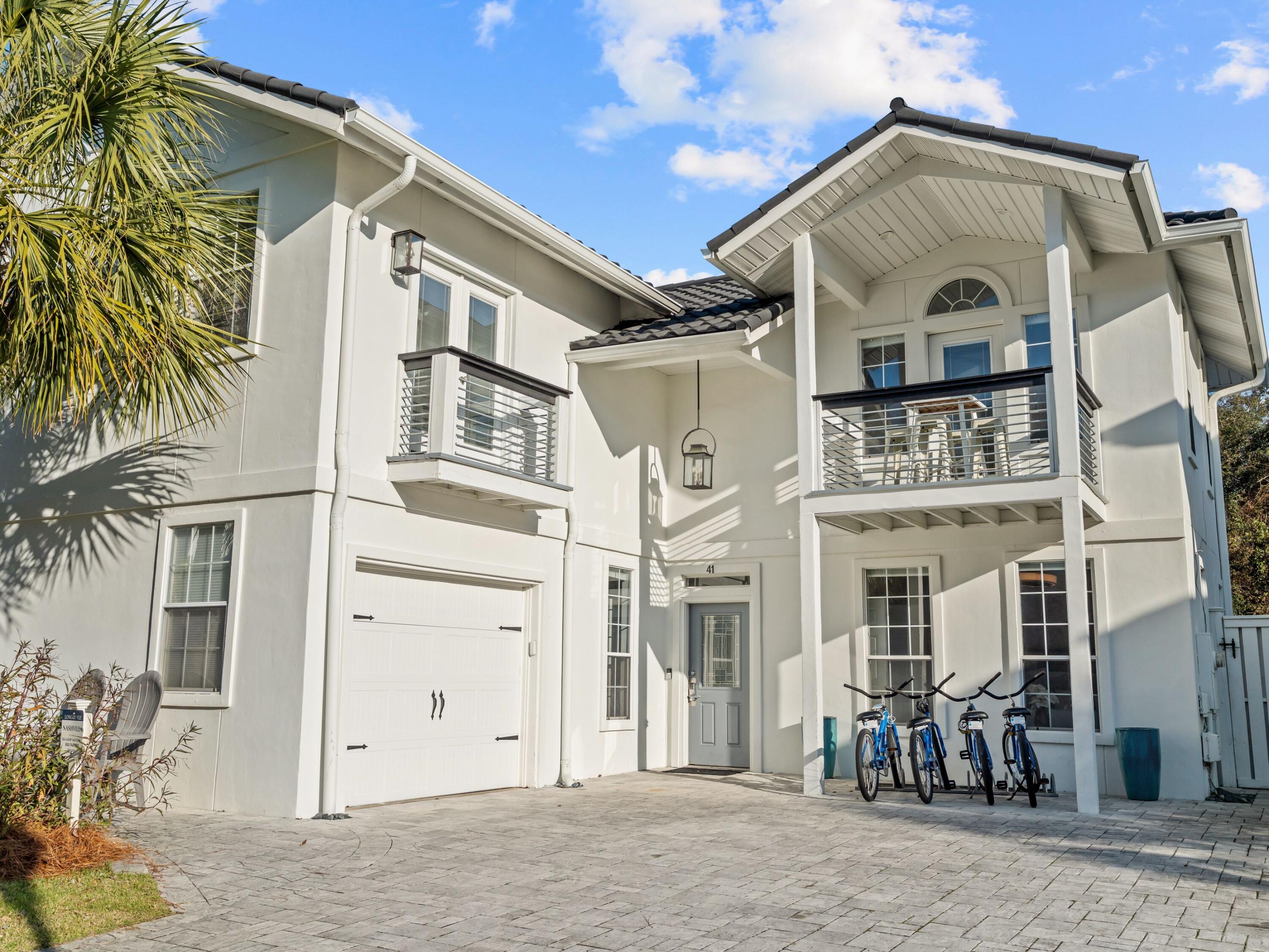 41 Longue Vue Drive Inlet Beach, FL 32461 - Photo 42 of 48 a view of a white building among the street with palm trees