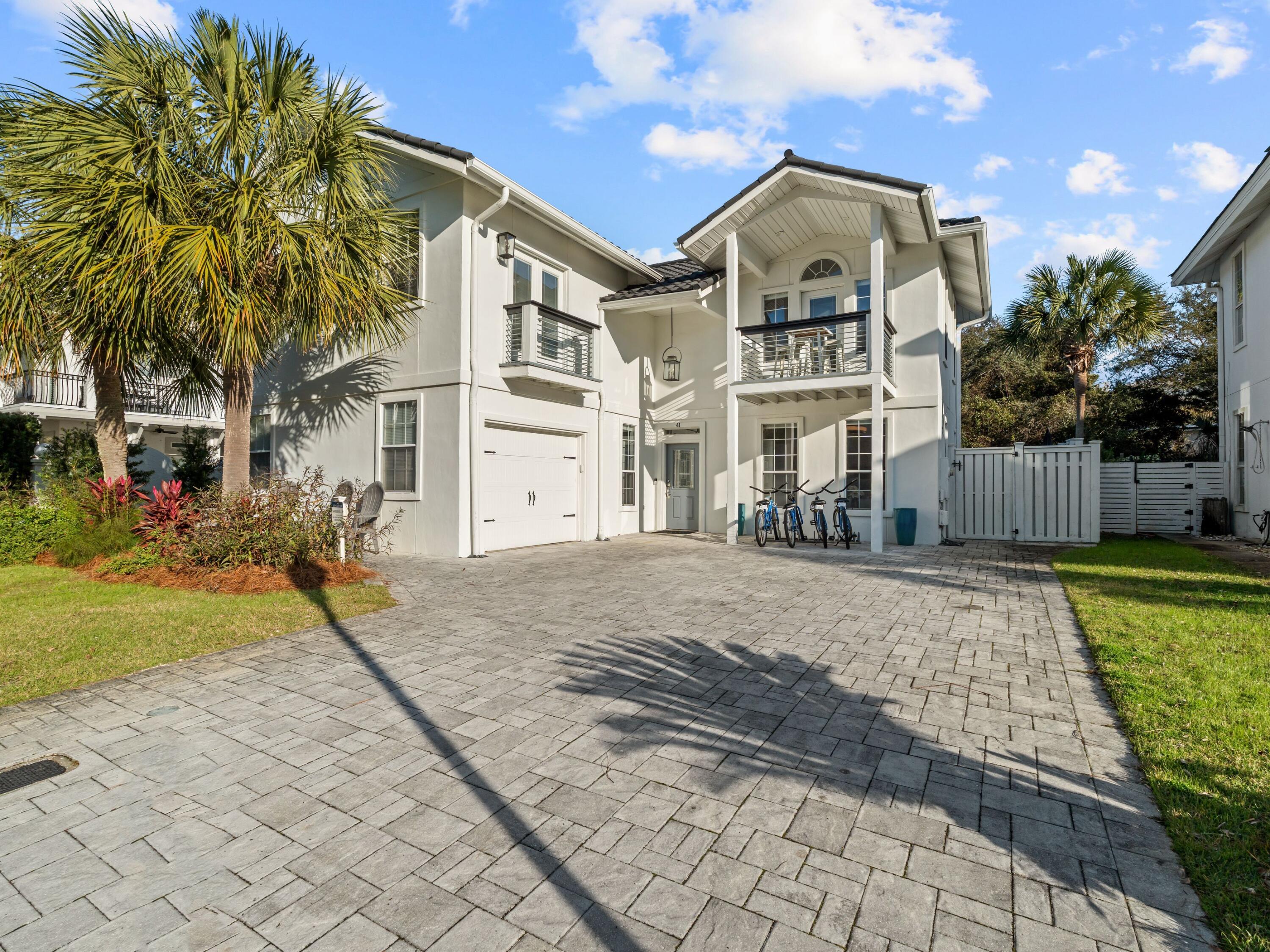 41 Longue Vue Drive Inlet Beach, FL 32461 - Photo 44 of 50 a front view of a house with a yard and garage