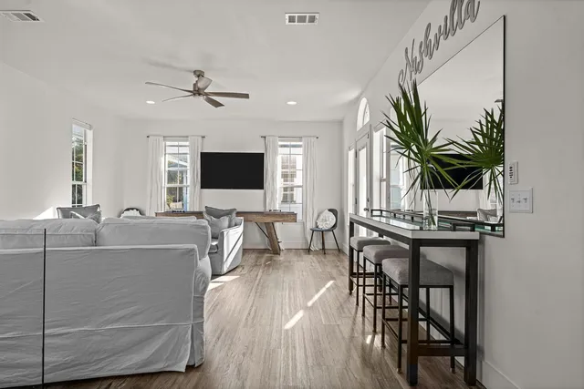 a view of a livingroom with furniture and a flat screen tv