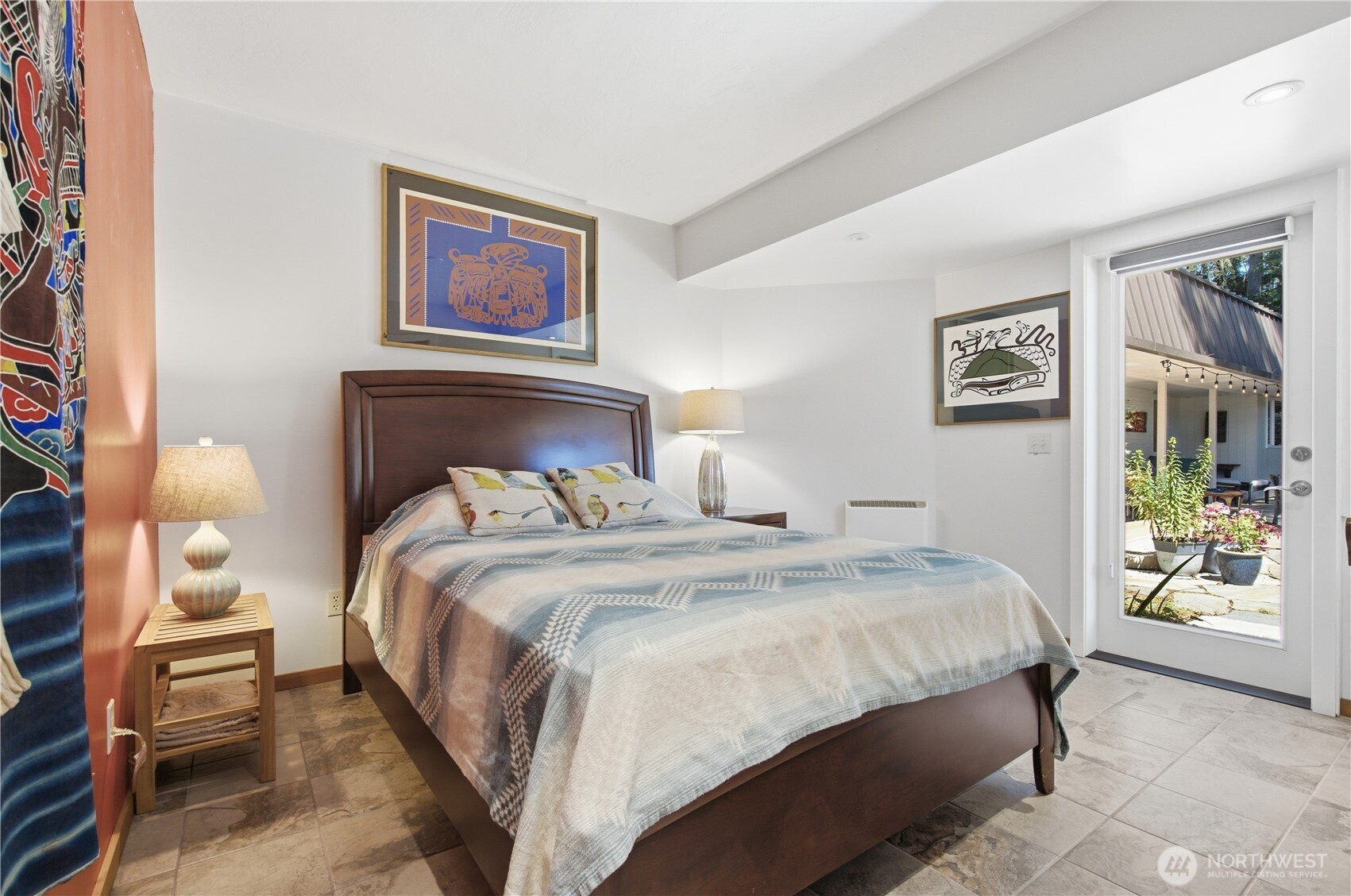 3050 Southeast Mullenix Road Port Orchard, WA 98367 - Photo 13 of 40 a bedroom with a bed and glass window