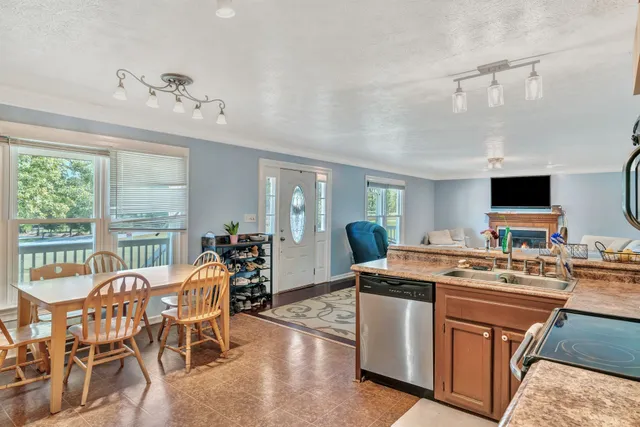 a view of a dining room with furniture window and outside view