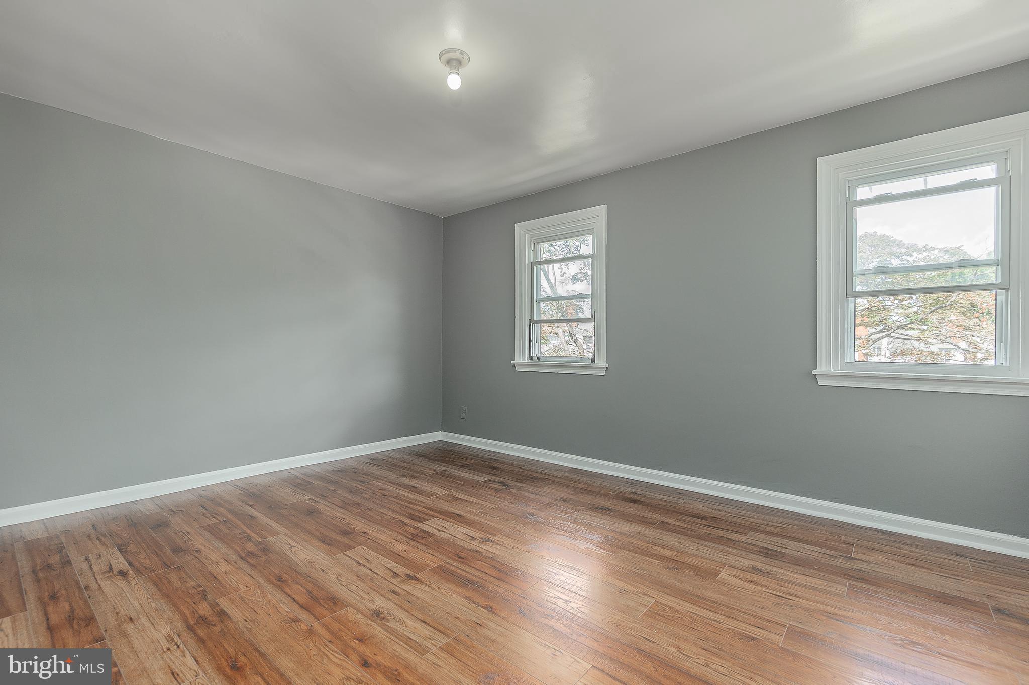 7278 Lamport Road Upper Darby, PA 19082 - Photo 16 of 29 a view of an empty room with wooden floor and a window