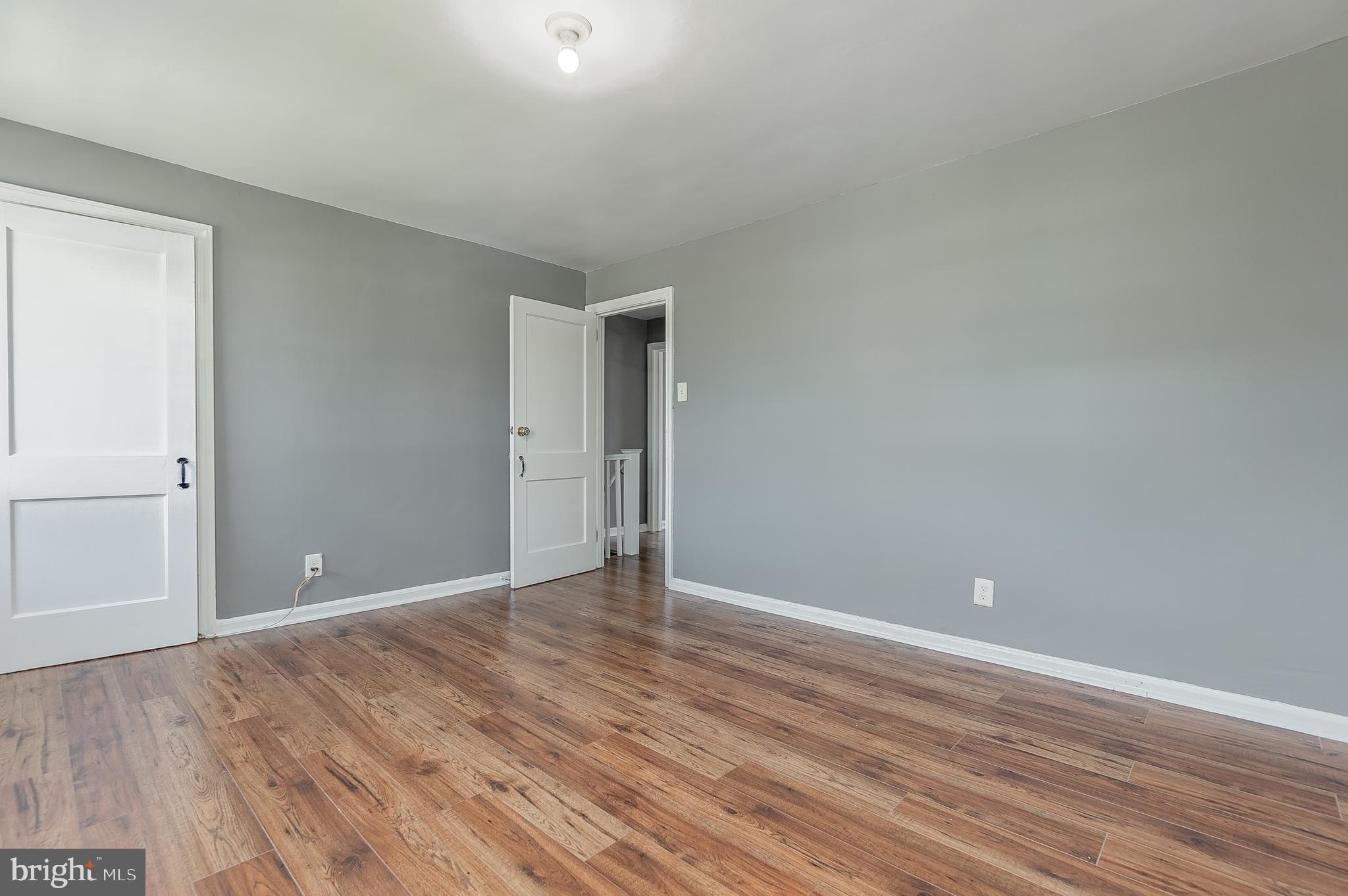 7278 Lamport Road Upper Darby, PA 19082 - Photo 17 of 29 a view of an empty room with wooden floor