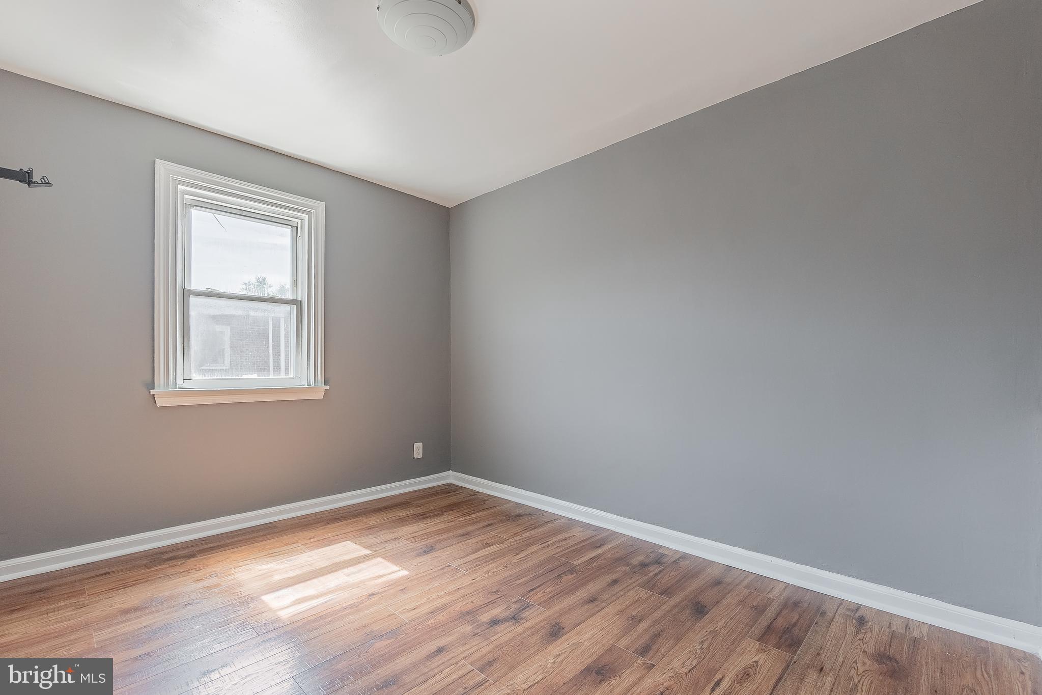 7278 Lamport Road Upper Darby, PA 19082 - Photo 20 of 29 a view of empty room with wooden floor and fan