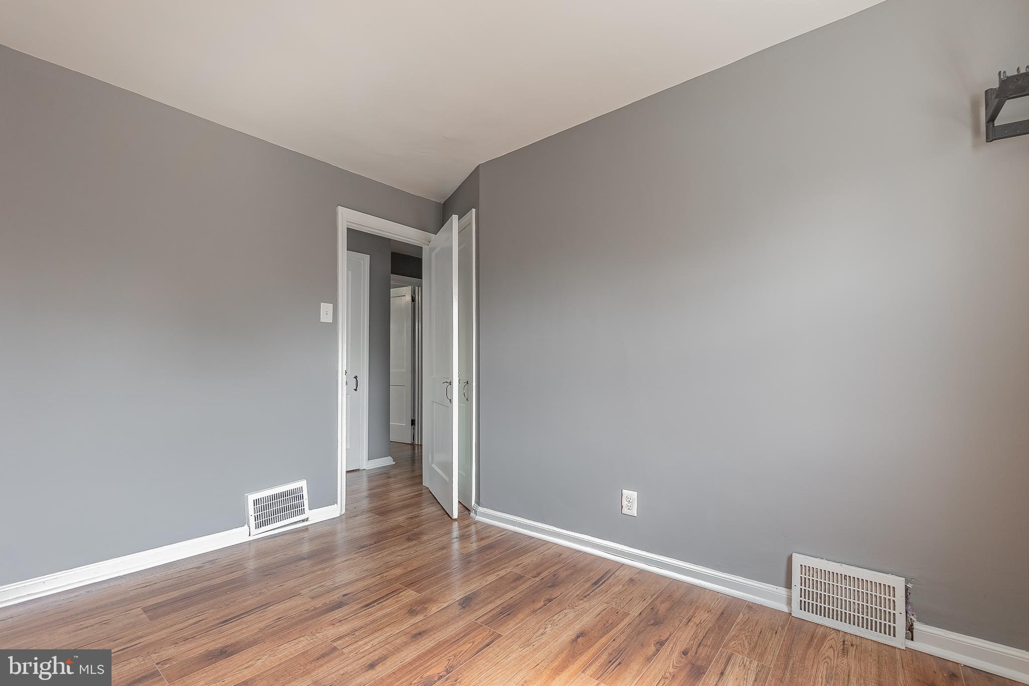7278 Lamport Road Upper Darby, PA 19082 - Photo 21 of 29 a view of an empty room with wooden floor