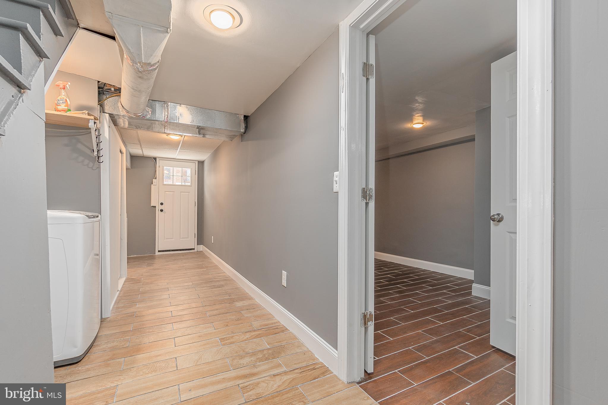 7278 Lamport Road Upper Darby, PA 19082 - Photo 24 of 29 a view of a hallway with wooden floor and staircase