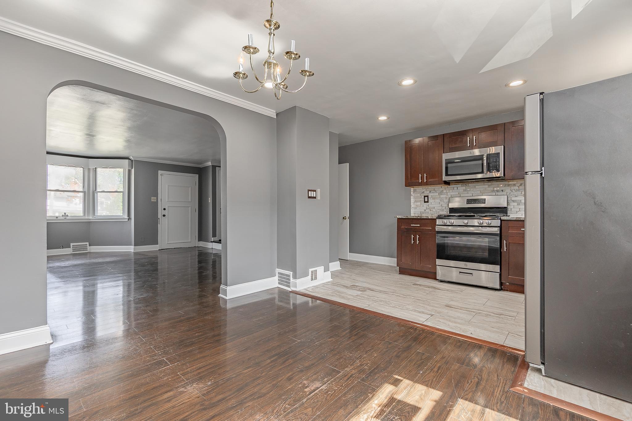 7278 Lamport Road Upper Darby, PA 19082 - Photo 9 of 29 a view of a kitchen with a sink and dishwasher wooden floor