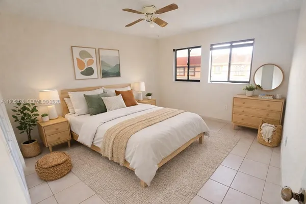 a bedroom with a bed and window