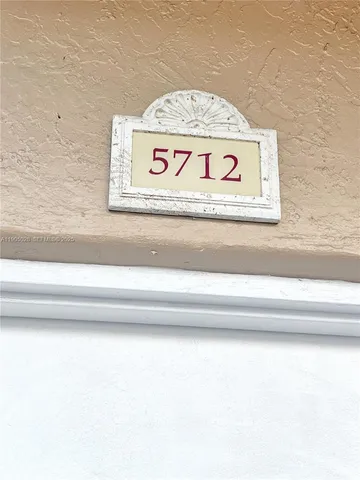 a view of kitchen with wooden floor and electronic appliances