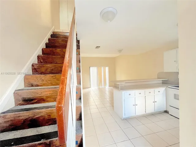 a kitchen with a cabinets and window