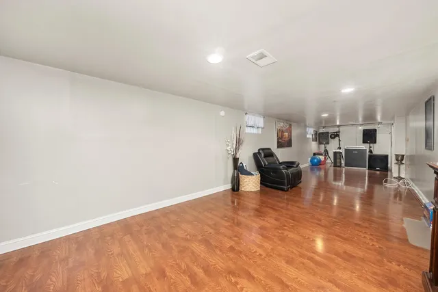 a view of kitchen with furniture and wooden floor