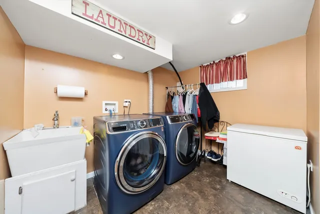 a view of storage and utility room with washer and dryer