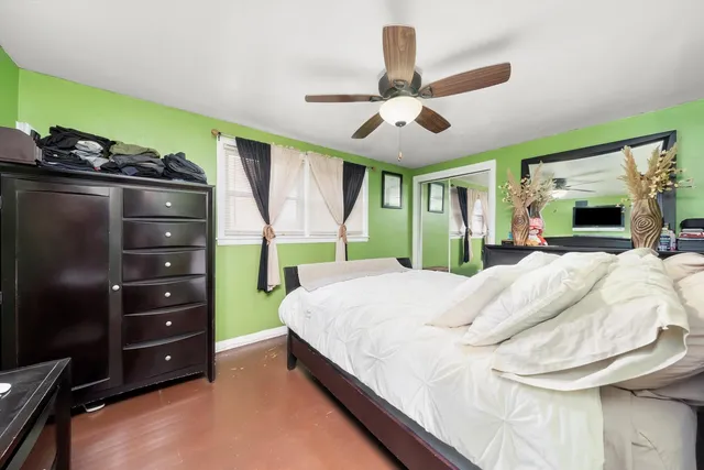 a bed room with a bed and a mirror