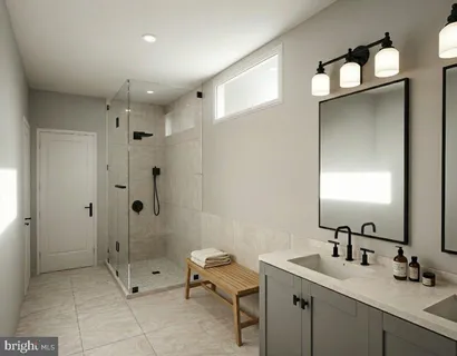 a bathroom with a shower sink and mirror