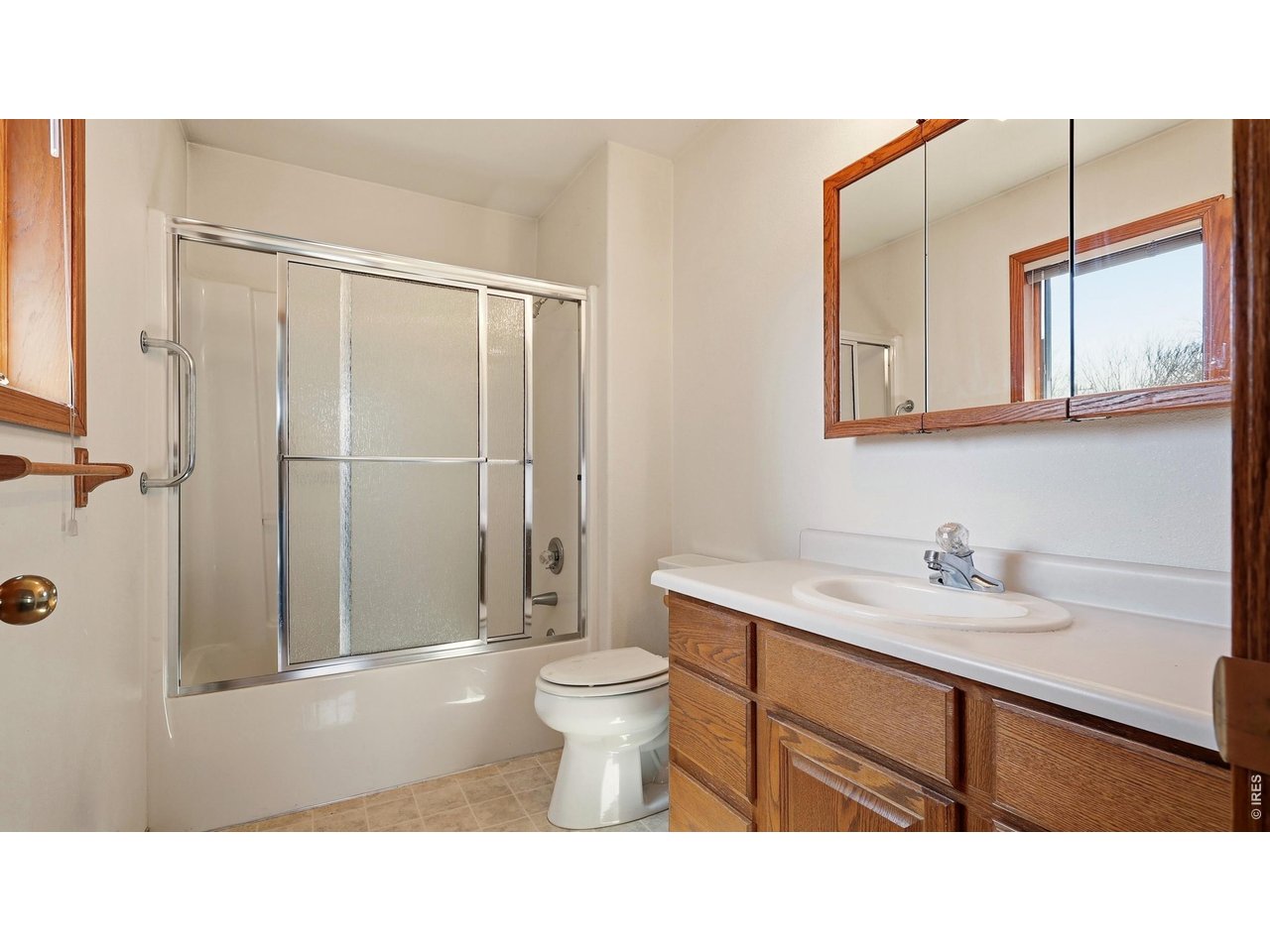 705 Ute Street Fort Morgan, CO 80701 - Photo 15 of 33 a bathroom with a sink a toilet and shower