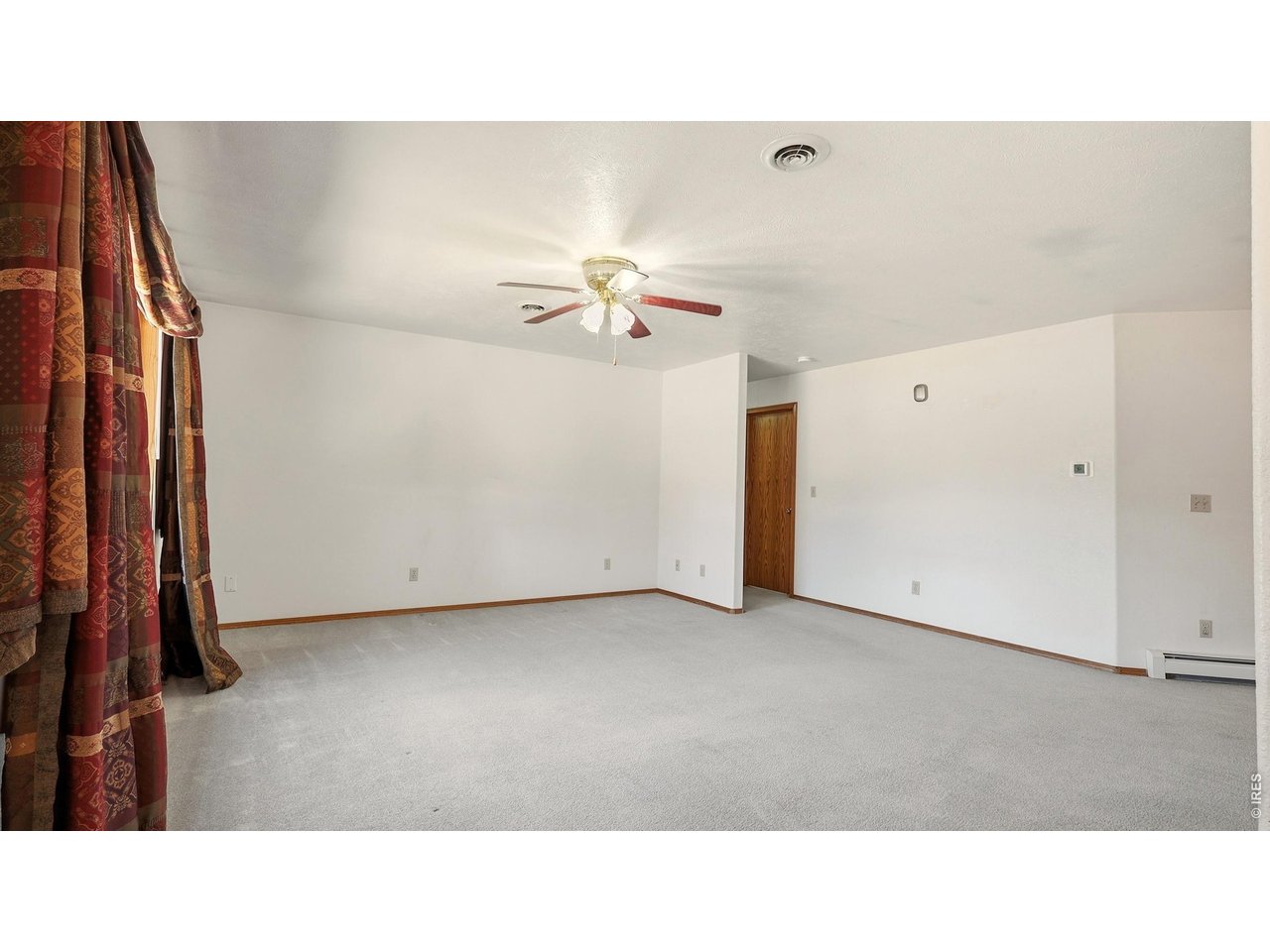 705 Ute Street Fort Morgan, CO 80701 - Photo 5 of 33 a open hall with a ceiling fan