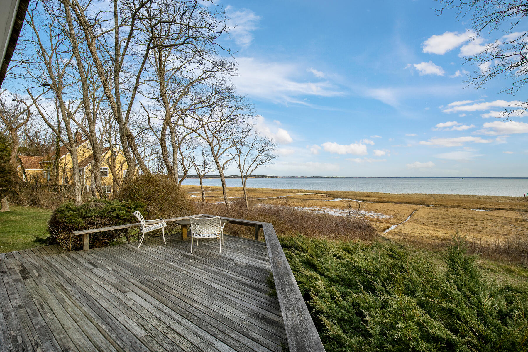 495 Chequessett Neck Road Wellfleet, MA 02667 - Photo 11 of 30 a view of a lake with chairs