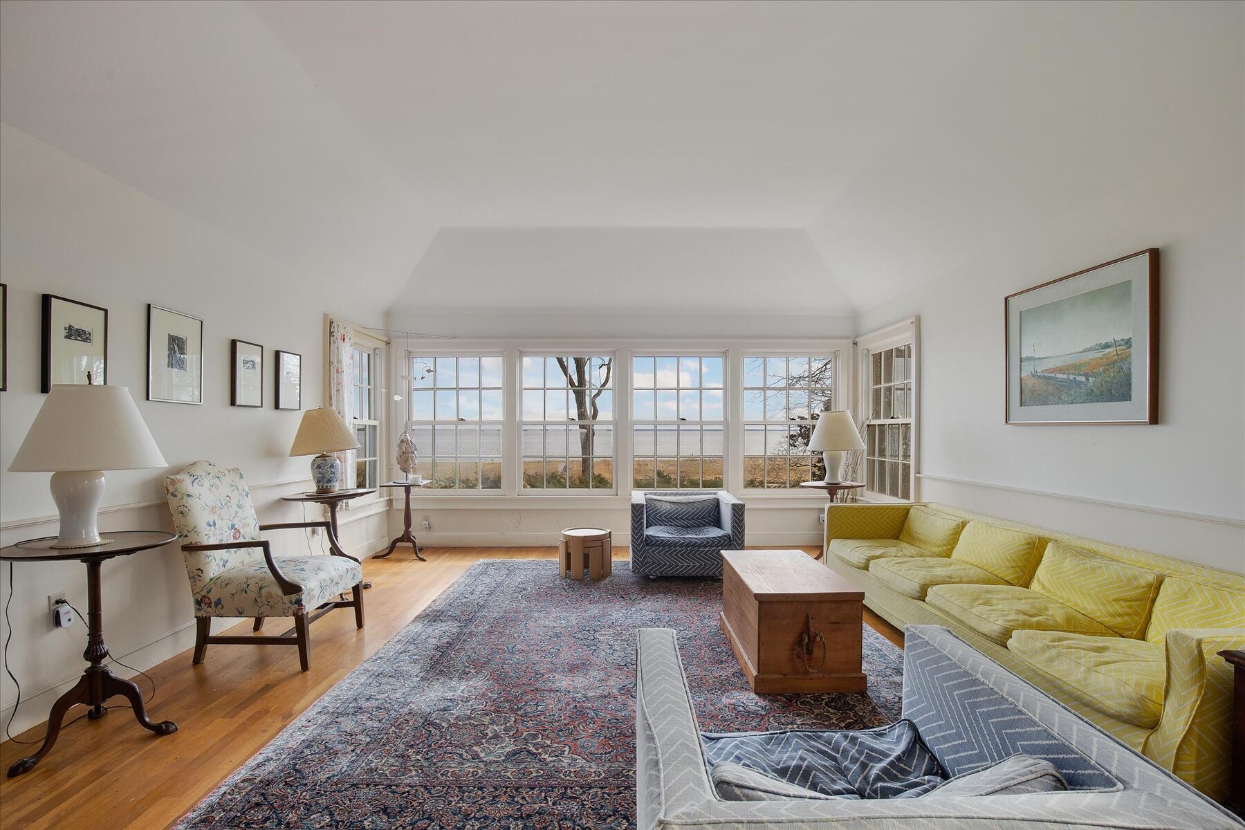 495 Chequessett Neck Road Wellfleet, MA 02667 - Photo 18 of 30 a living room with furniture and a large window