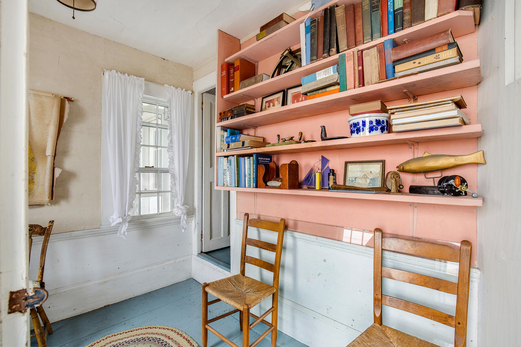 495 Chequessett Neck Road Wellfleet, MA 02667 - Photo 25 of 30 a living room with furniture cabinets and a window