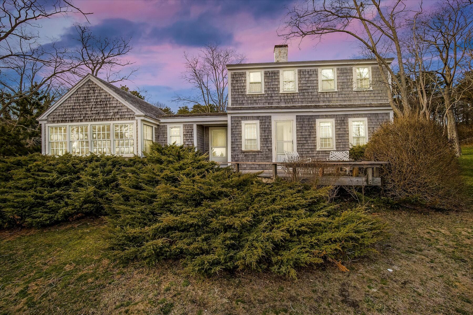 495 Chequessett Neck Road Wellfleet, MA 02667 - Photo 3 of 30 a front view of a house with a yard