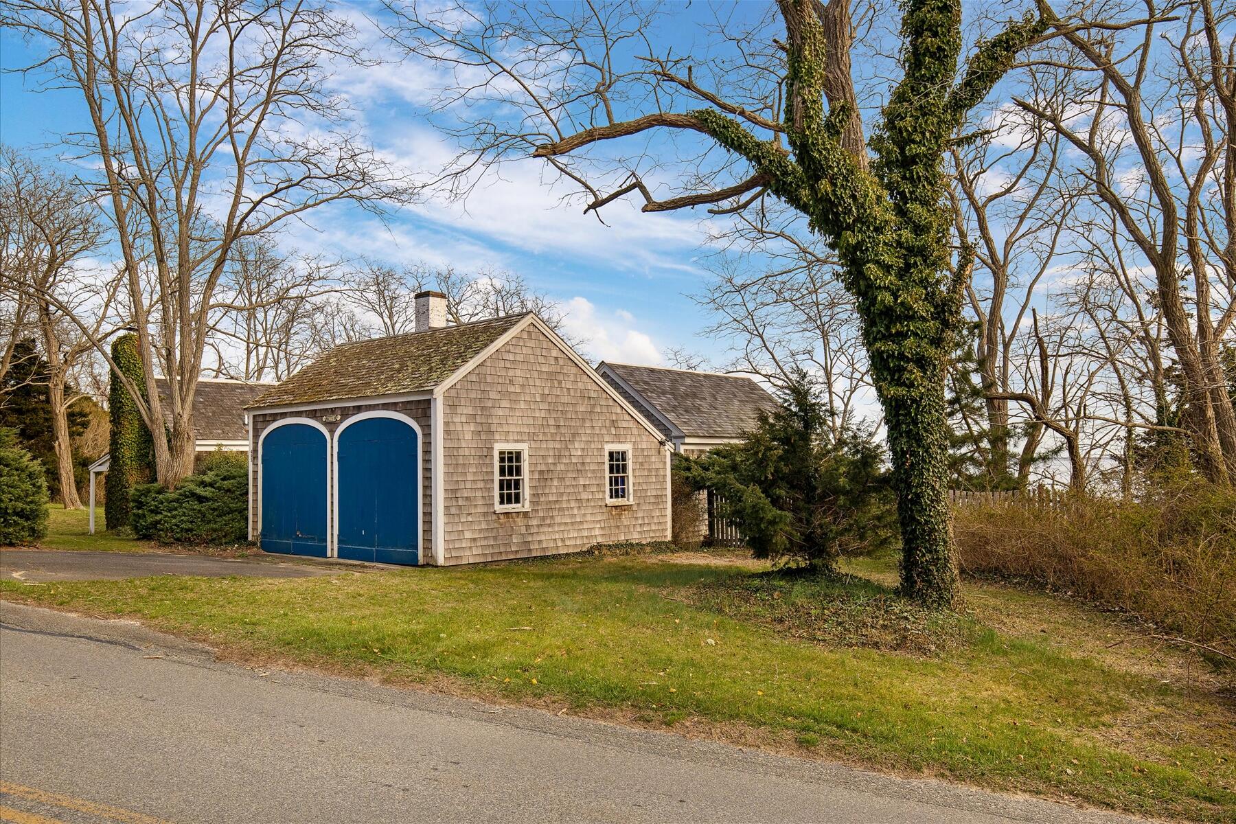 495 Chequessett Neck Road Wellfleet, MA 02667 - Photo 6 of 30 a view of a yard with a large tree
