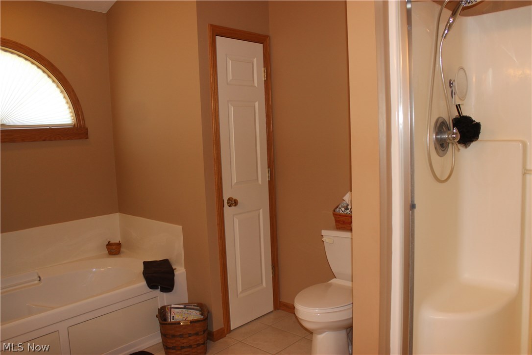2005 Summerchase Road Northeast Canton, OH 44721 - Photo 23 of 35 Separate shower and tub area. Ceramic tile flooring. Extra linen closet in this room too.