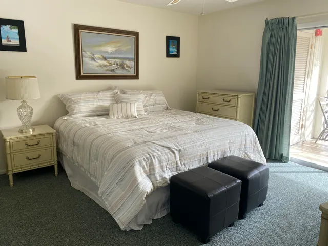 a bedroom with bed and a window