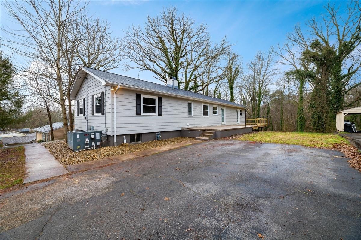135 Georgia Avenue Oak Ridge, TN 37830 - Photo 2 of 32 a view of a house with a yard and large tree
