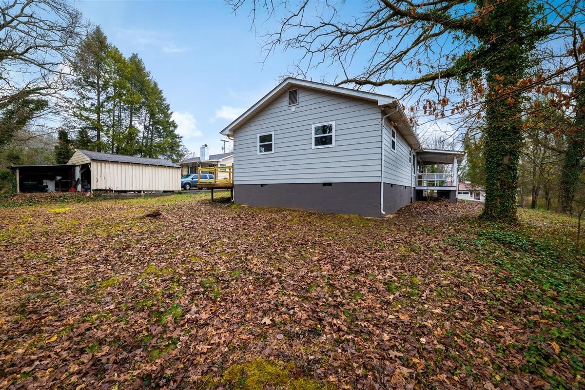 135 Georgia Avenue Oak Ridge, TN 37830 - Photo 29 of 32 a view of a house with a yard