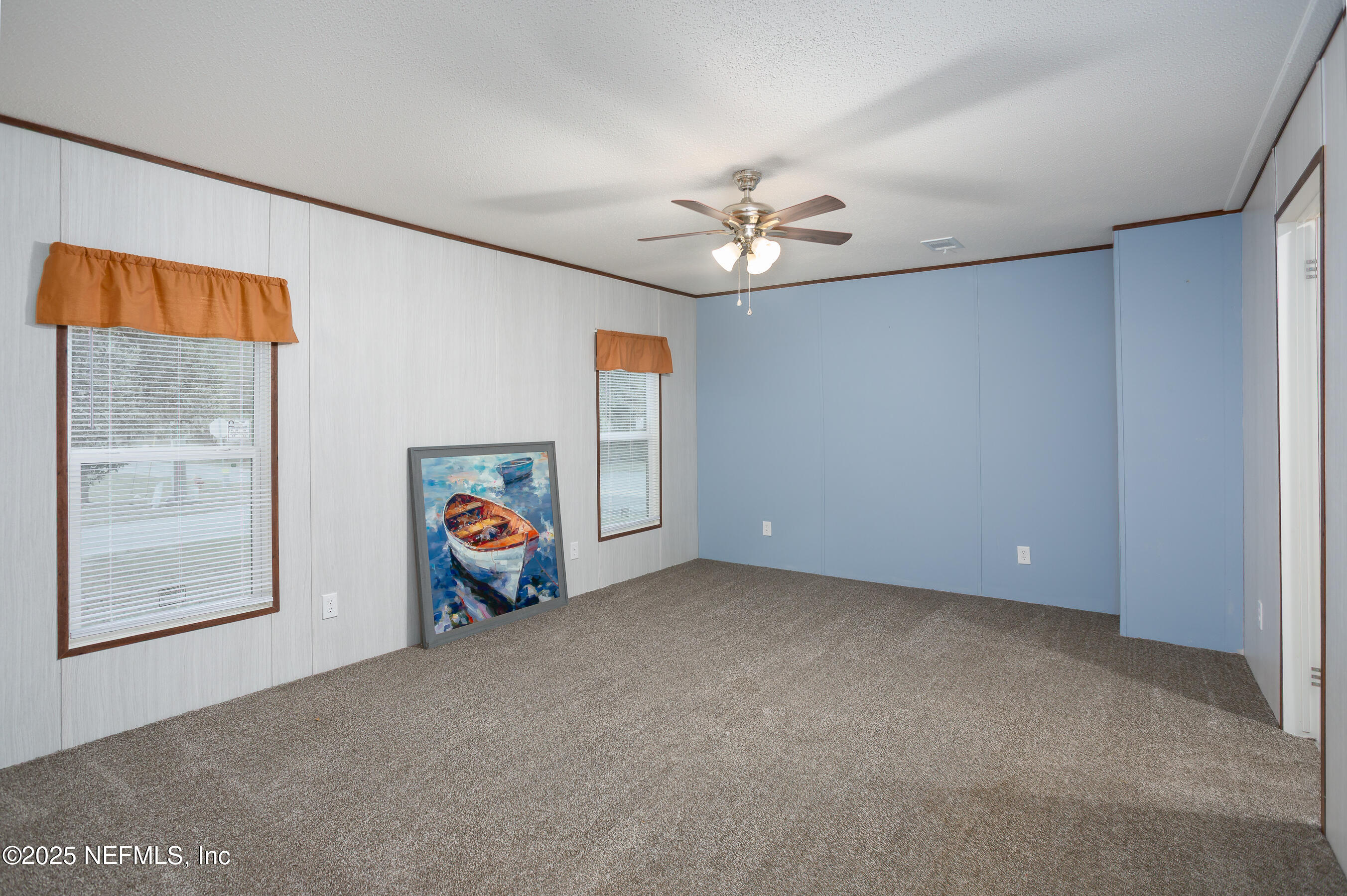 1001 Shell Street Welaka, FL 32193 - Photo 11 of 28 a view of a room with window & ceiling fan