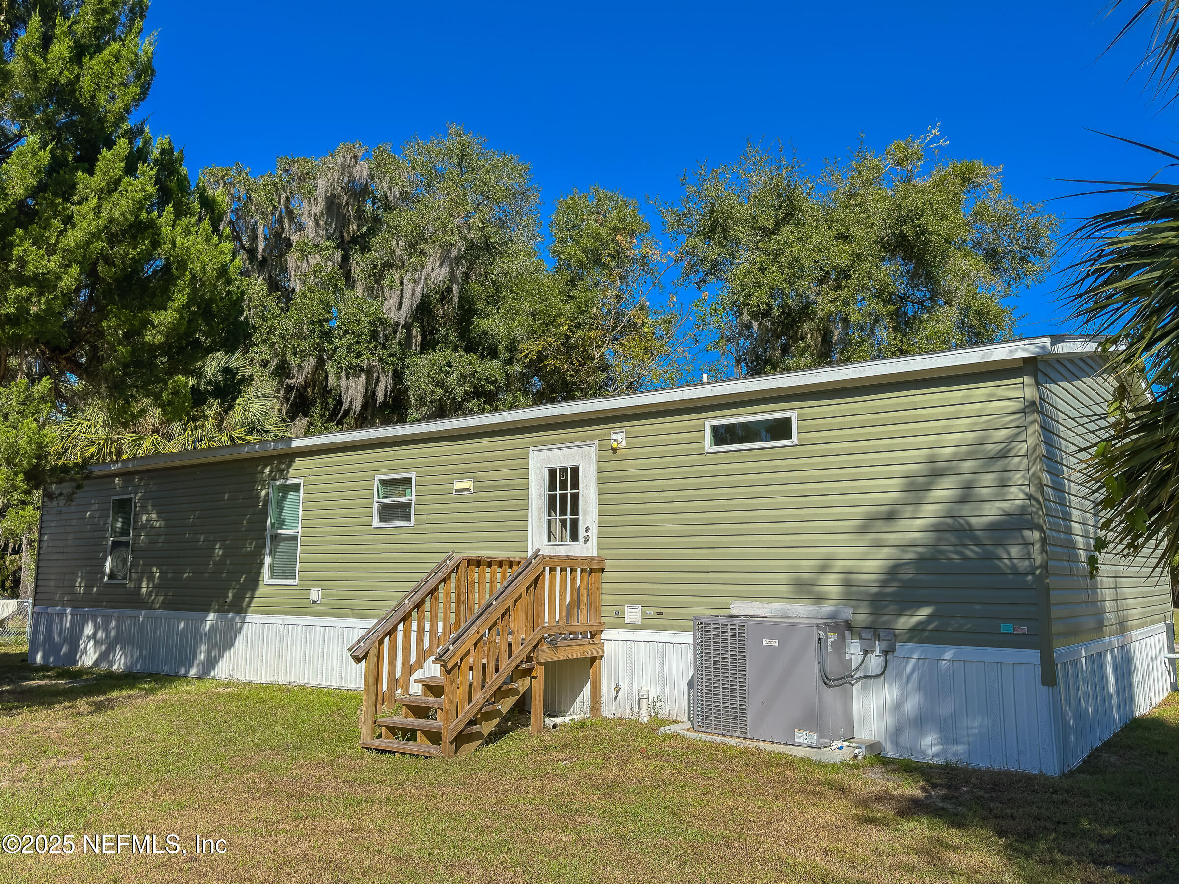 1001 Shell Street Welaka, FL 32193 - Photo 16 of 21 a view of a house with a yard