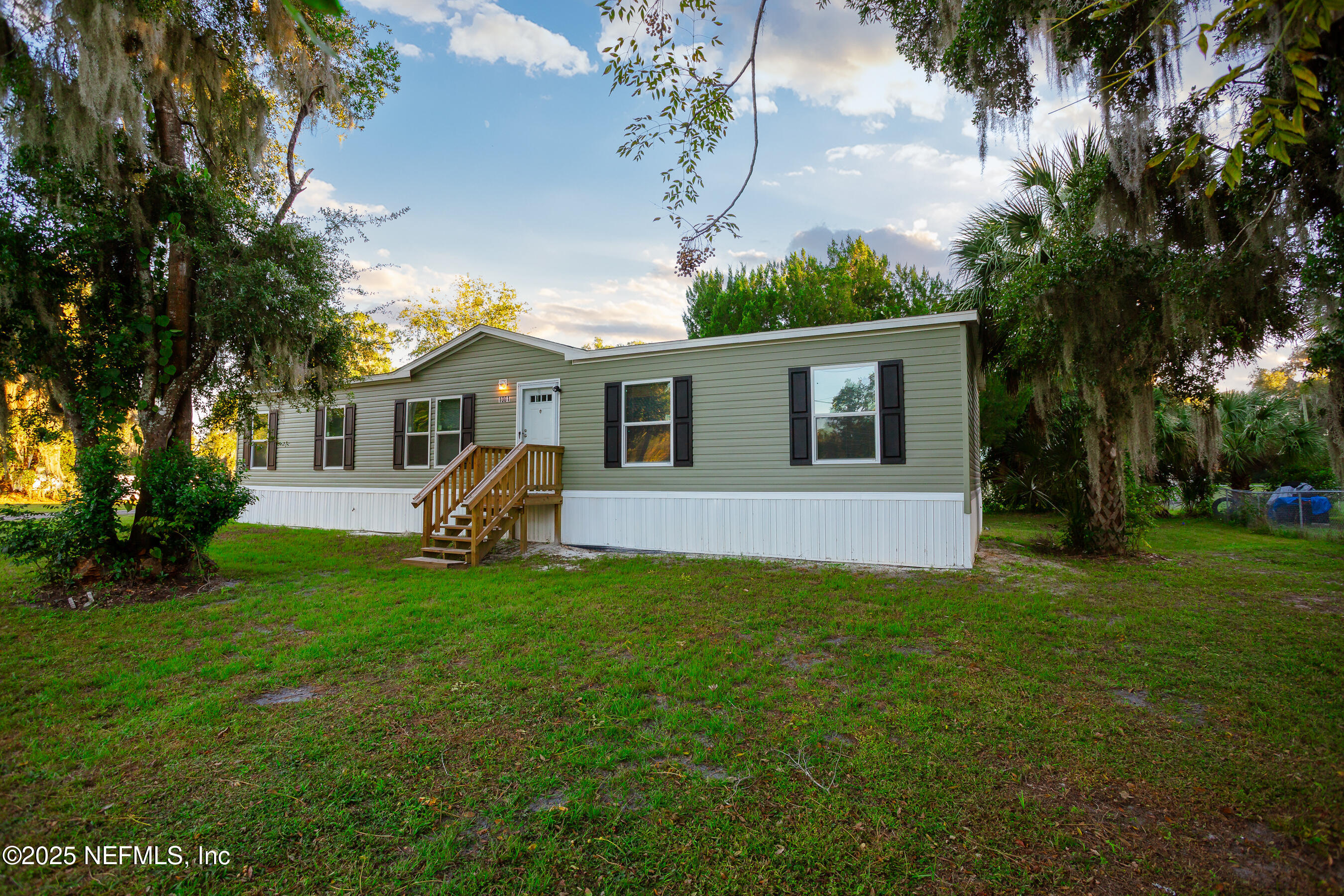 1001 Shell Street Welaka, FL 32193 - Photo 2 of 21 a view of a house with a patio and a yard