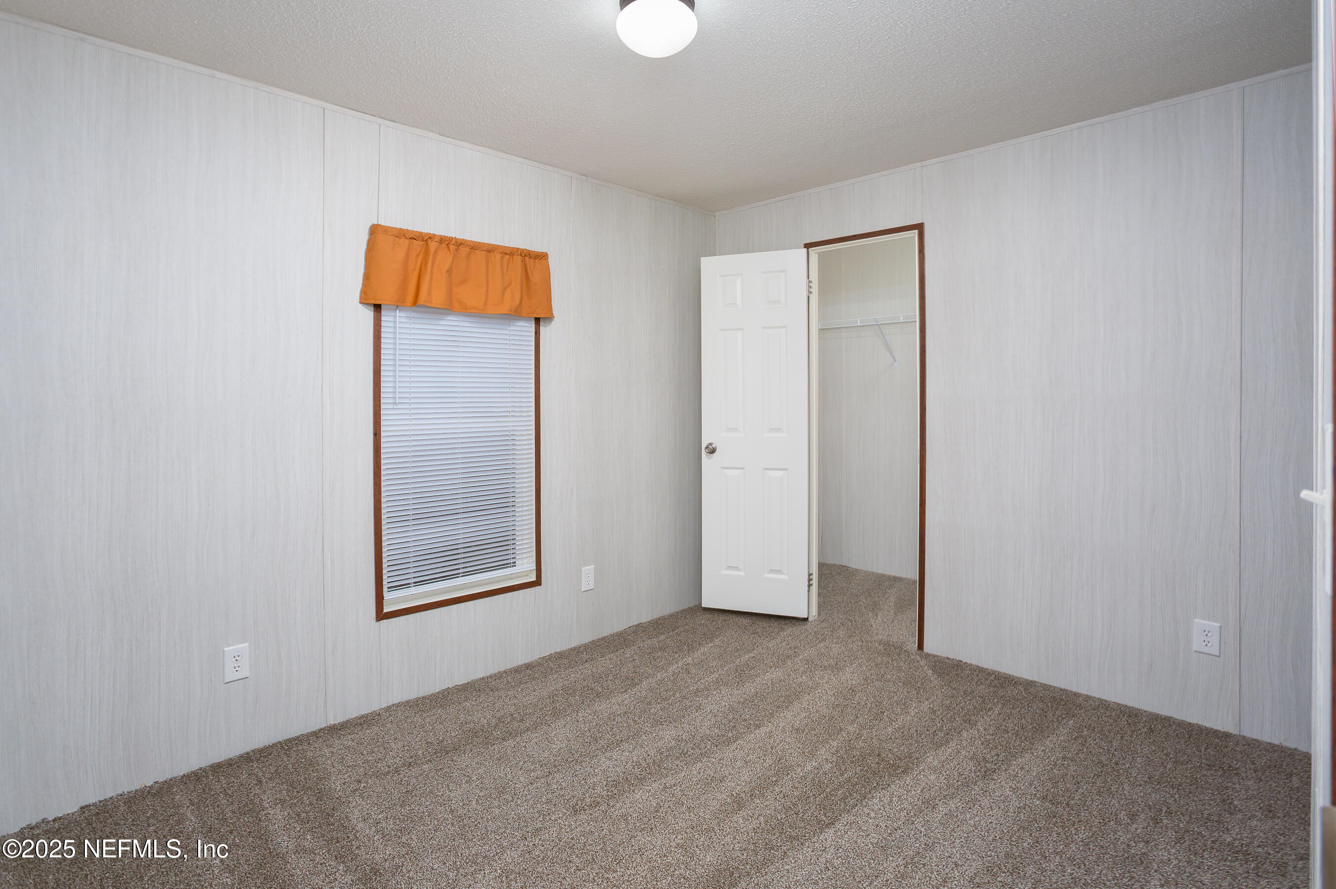 1001 Shell Street Welaka, FL 32193 - Photo 21 of 28 an empty room with windows and closet