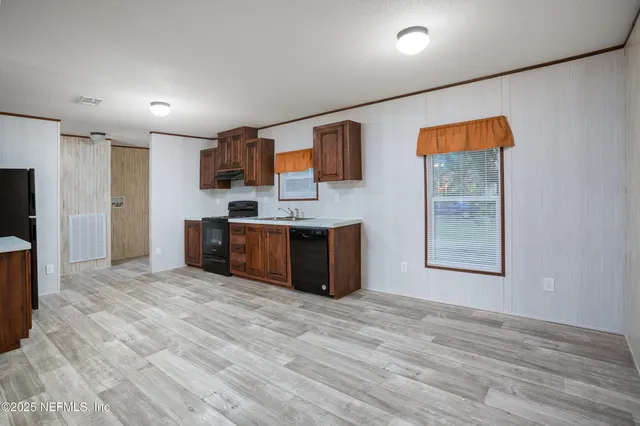 a view of a hallway with wooden shelves